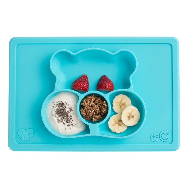 EZPZ, Silikonowy talerzyk z podkładką 2w1 Care Bears™ Mat Misia Życzliwe Serce Wish Bear turkusowy EZPZ, Silikonowy talerzyk z podkładką 2w1 Care Bears™ Mat Misia Życzliwe Serce Wish Bear turkusowy